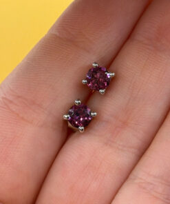 Vintage sterling silver stud earrings featuring tourmaline or cubic zirconia