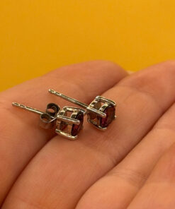 Vintage sterling silver stud earrings featuring tourmaline or cubic zirconia