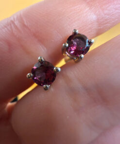 Vintage sterling silver stud earrings featuring tourmaline or cubic zirconia
