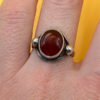 vintage sterling silver ring features a large, oval-shaped cabochon carnelian stone Size M#146
