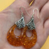 A pair of ornate sterling silver and reconstituted amber earrings #151