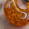 A pair of ornate sterling silver and reconstituted amber earrings #151