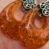 A pair of ornate sterling silver and reconstituted amber earrings #151