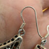 A pair of ornate sterling silver and reconstituted amber earrings #151