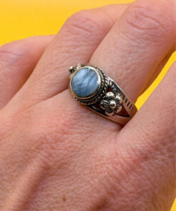 silver ring with a moonstone, adorned with floral patterns. Size R#14