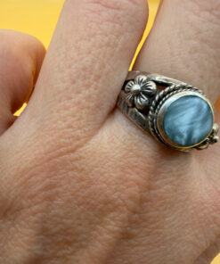 silver ring with a moonstone, adorned with floral patterns. Size R