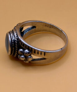 silver ring with a moonstone, adorned with floral patterns. Size R