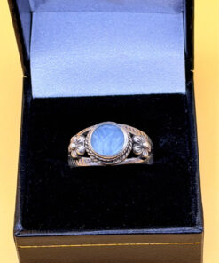 silver ring with a moonstone, adorned with floral patterns. Size R