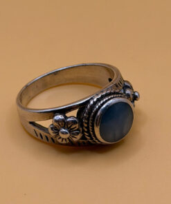 silver ring with a moonstone, adorned with floral patterns. Size R