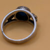 silver ring with a moonstone, adorned with floral patterns. Size R#14