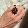New 925 sterling silver ring with garnets, weight 8.6 g, size O.