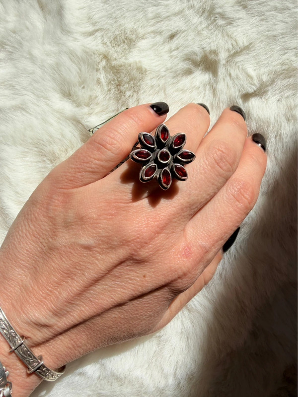 New 925 sterling silver ring with garnets, weight 8.6 g, size O.