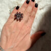 New 925 sterling silver ring with garnets, weight 8.6 g, size O.