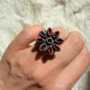 New 925 sterling silver ring with garnets, weight 8.6 g, size O.