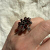 New 925 sterling silver ring with garnets, weight 8.6 g, size O.