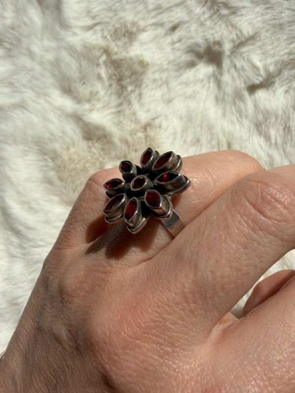 New 925 sterling silver ring with garnets, weight 8.6 g, size O.