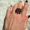 New 925 sterling silver ring with garnets, weight 8.6 g, size O.