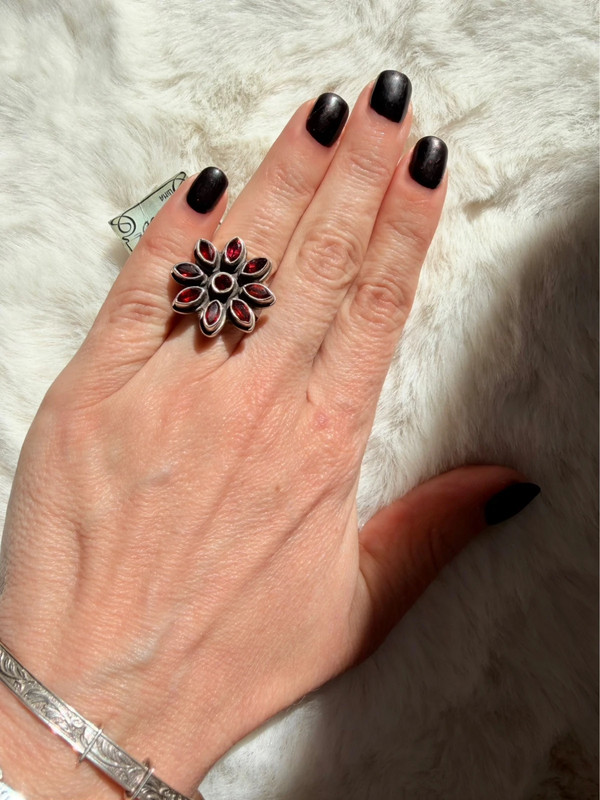 New 925 sterling silver ring with garnets, weight 8.6 g, size O.