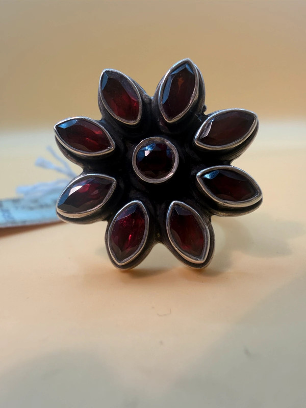 New 925 sterling silver ring with garnets, weight 8.6 g, size O.