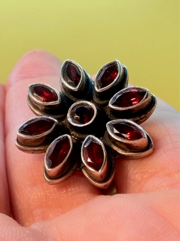 New 925 sterling silver ring with garnets, weight 8.6 g, size O.
