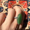 Uk size Q, silver plated ring with green unknown stone