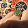 Uk size Q, silver plated ring with green unknown stone