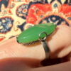 Uk size Q, silver plated ring with green unknown stone