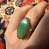 Uk size Q, silver plated ring with green unknown stone