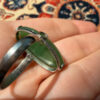 Uk size Q, silver plated ring with green unknown stone