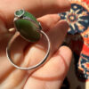 Uk size Q, silver plated ring with green unknown stone
