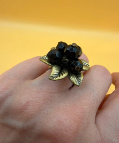 Size L, adjustable ring with black beads.
