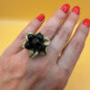 Size L, adjustable ring with black beads.