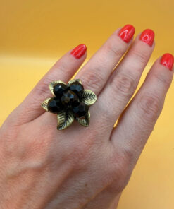 Size L, adjustable ring with black beads.