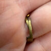 Size L, adjustable ring with black beads.