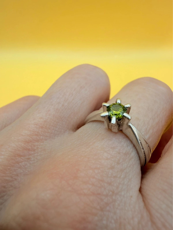 A silver ring with a natural peridot, size N #37