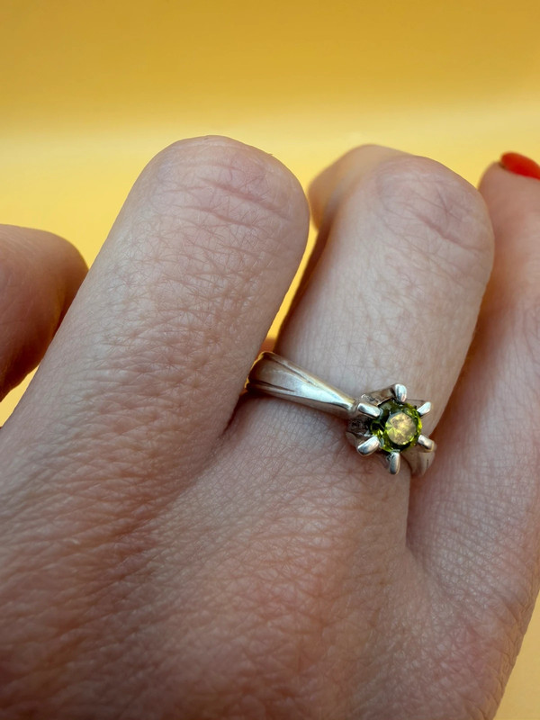 A silver ring with a natural peridot, size N #37