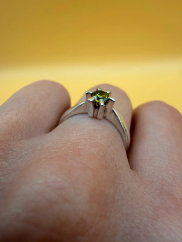 A silver ring with a natural peridot, size N #37