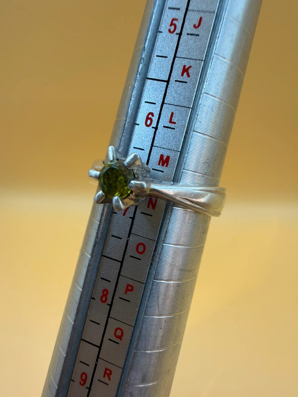 A silver ring with a natural peridot, size N #37
