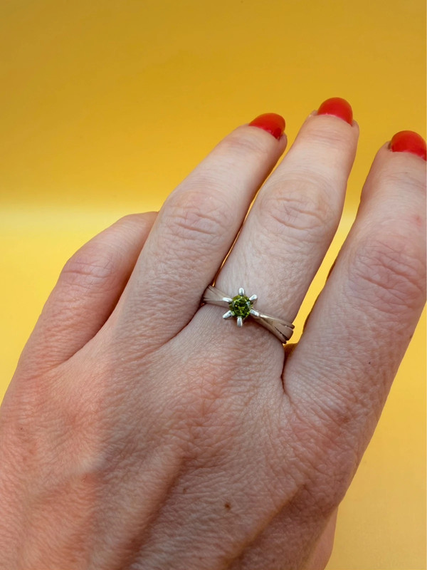 A silver ring with a natural peridot, size N #37