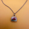 Silver bell-shaped pendant (jingles) and a Soviet-era silver chain