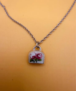 Silver bell-shaped pendant (jingles) and a Soviet-era silver chain