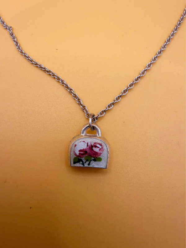Silver bell-shaped pendant (jingles) and a Soviet-era silver chain