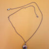 Silver bell-shaped pendant (jingles) and a Soviet-era silver chain