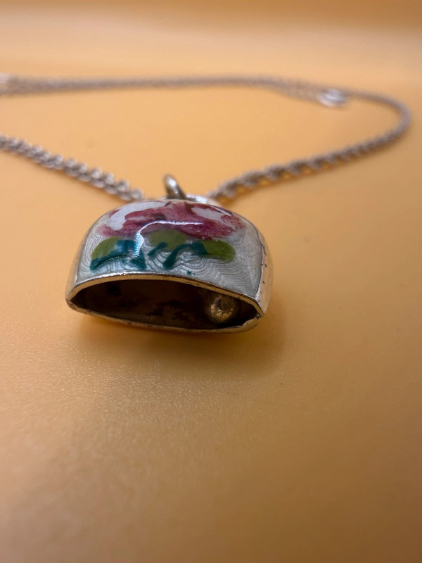 Silver bell-shaped pendant (jingles) and a Soviet-era silver chain