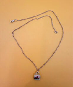 Silver bell-shaped pendant (jingles) and a Soviet-era silver chain