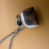 Silver bell-shaped pendant (jingles) and a Soviet-era silver chain