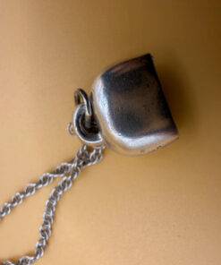 Silver bell-shaped pendant (jingles) and a Soviet-era silver chain