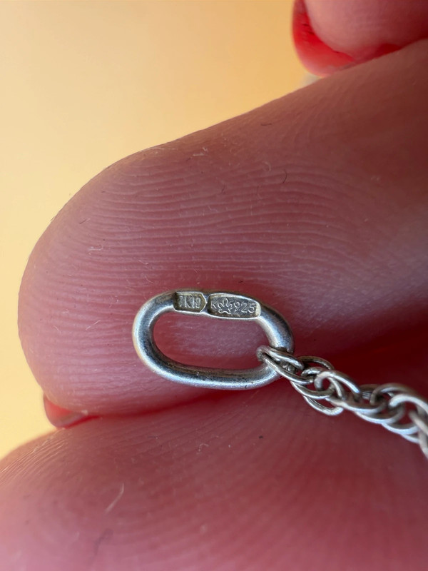 Silver bell-shaped pendant (jingles) and a Soviet-era silver chain