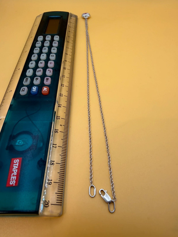Silver bell-shaped pendant (jingles) and a Soviet-era silver chain