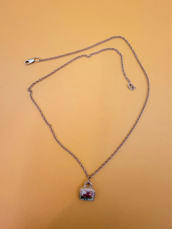 Silver bell-shaped pendant (jingles) and a Soviet-era silver chain